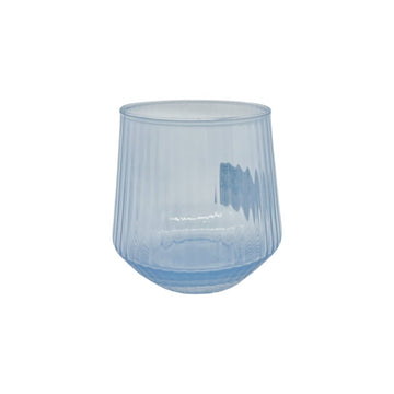 Light blue glass tumbler with faceted sides and round rim