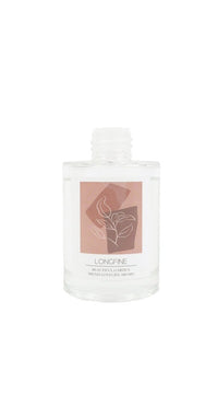 Reed diffuser bottle close-up with Longfine label on clear glass