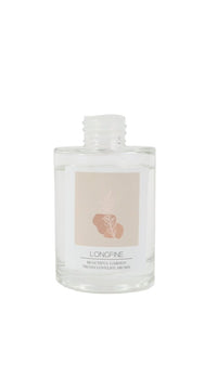 Amber lily scented reed diffuser bottle with frosted clear glass and beige label
