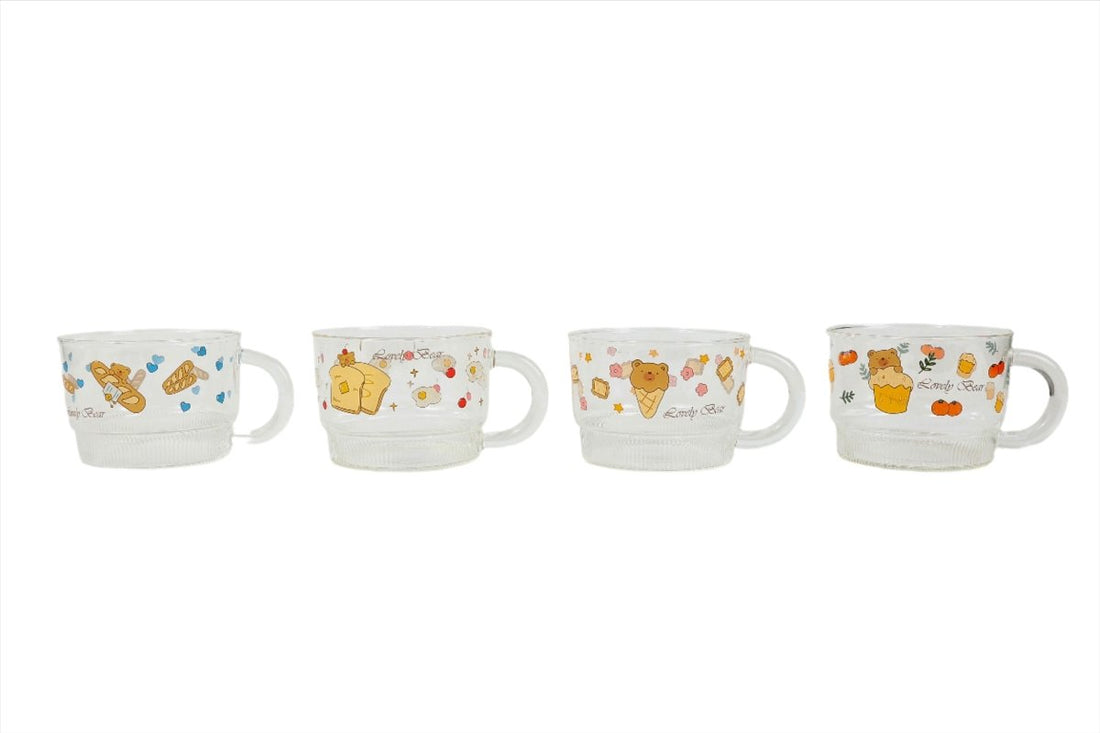 Set of kids glass cups with different bear-themed prints, each with a wide handle