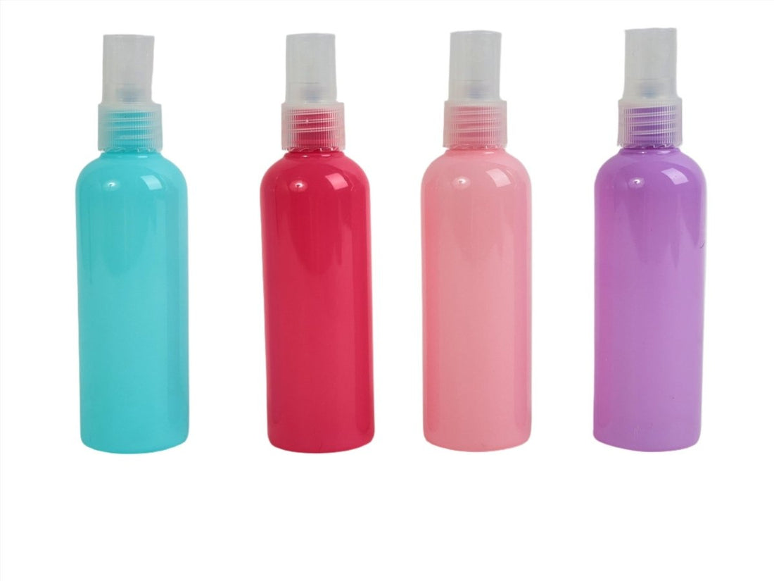Travel bottle kit with four 100ml bottles in turquoise, red, pink, and purple