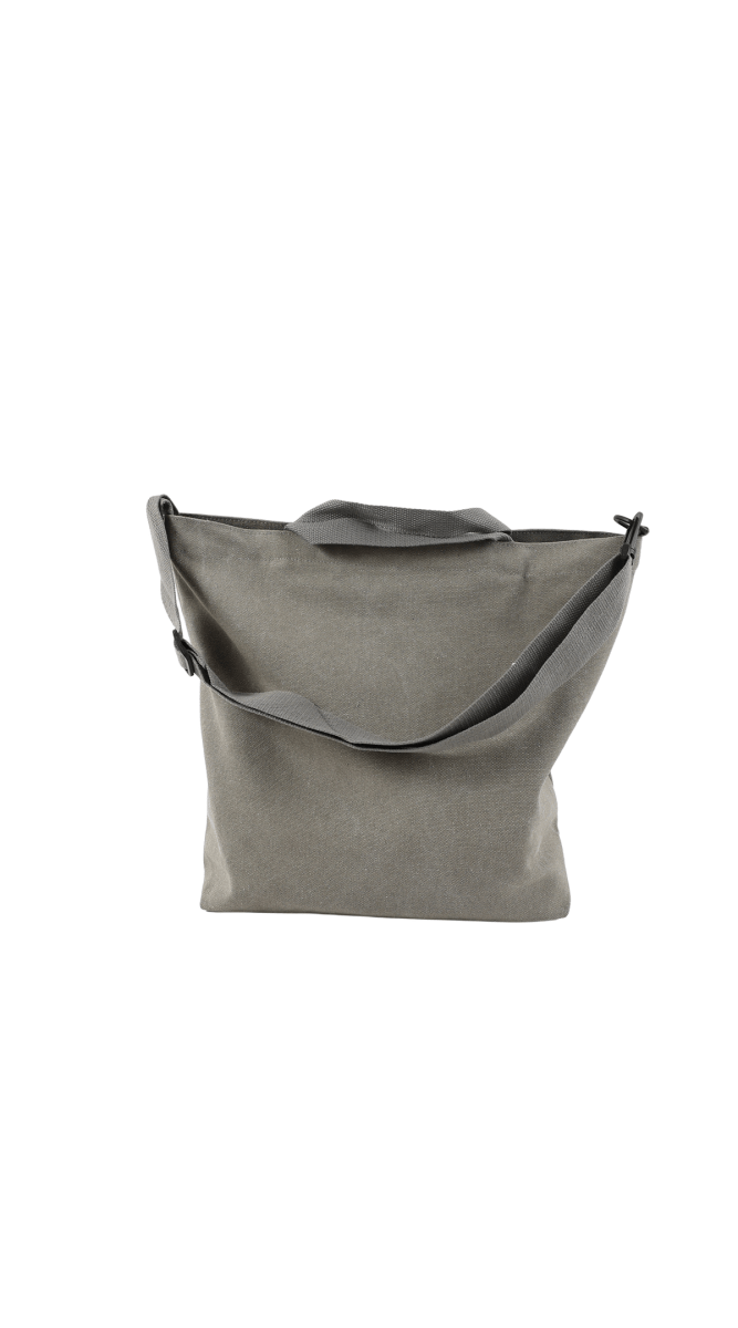 Gray canvas tote bag with open top, top handles, and side buckles.