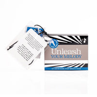 Gift box with karaoke design plus an included paper insert and hanging keychain