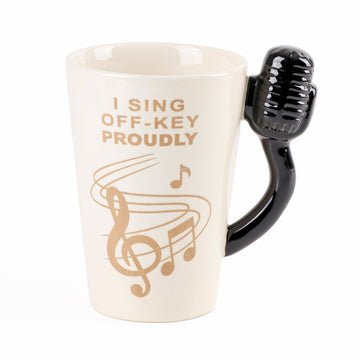 Beige ceramic karaoke cup with black microphone-shaped handle and treble-clef design