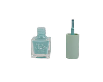 Light blue nail polish bottle with open cap and precision brush applicator