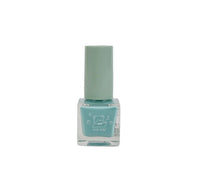 Light blue nail polish bottle with closed cap and square glass base