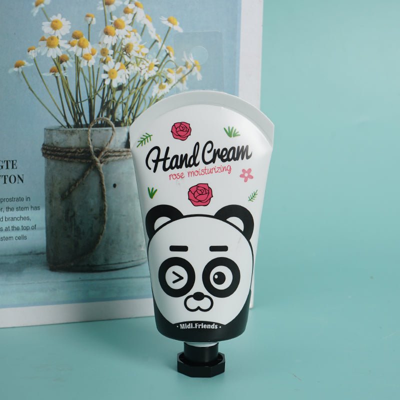 Hand cream tube with panda face illustration and rose flowers, on squeeze base