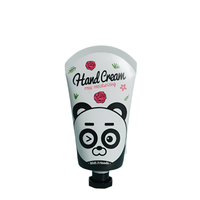 Hand cream tube with panda graphic and rose motif, squeeze-top
