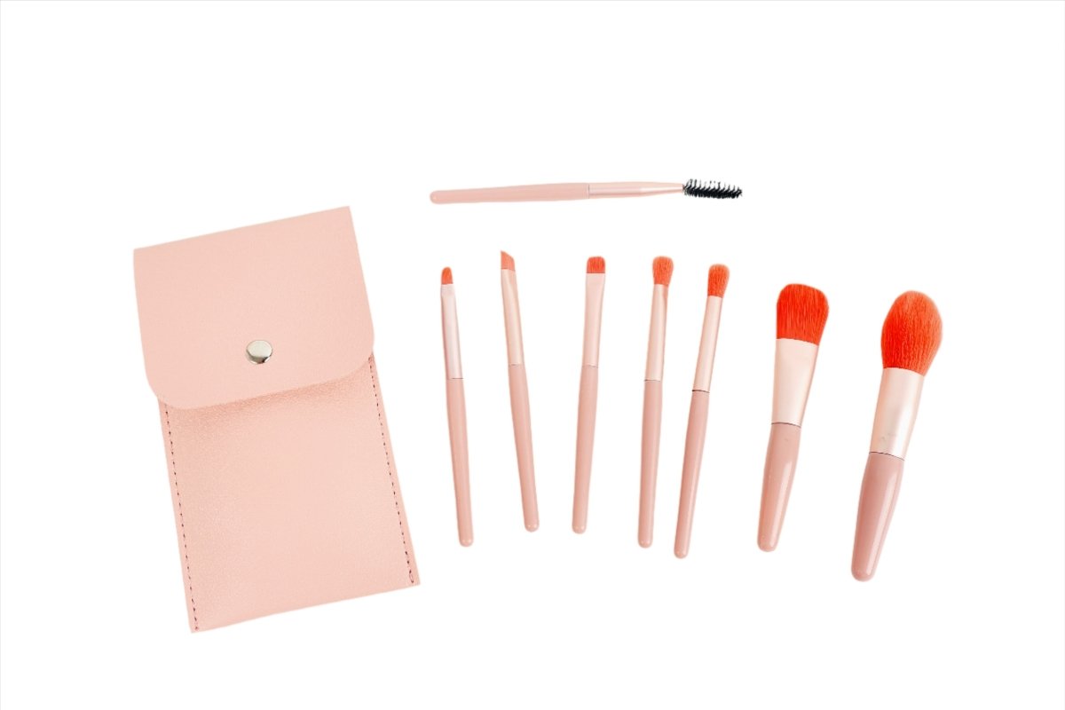 Pink makeup brush set with 8 brushes, some shown laid out