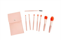 Pink makeup brush set with 8 brushes, some shown laid out