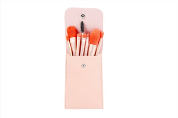 Pink makeup brush set with 8 brushes in a matching fold-over pouch
