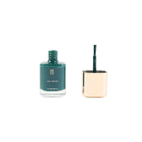 Nail polish bottle with brush applicator showing dark green liquid