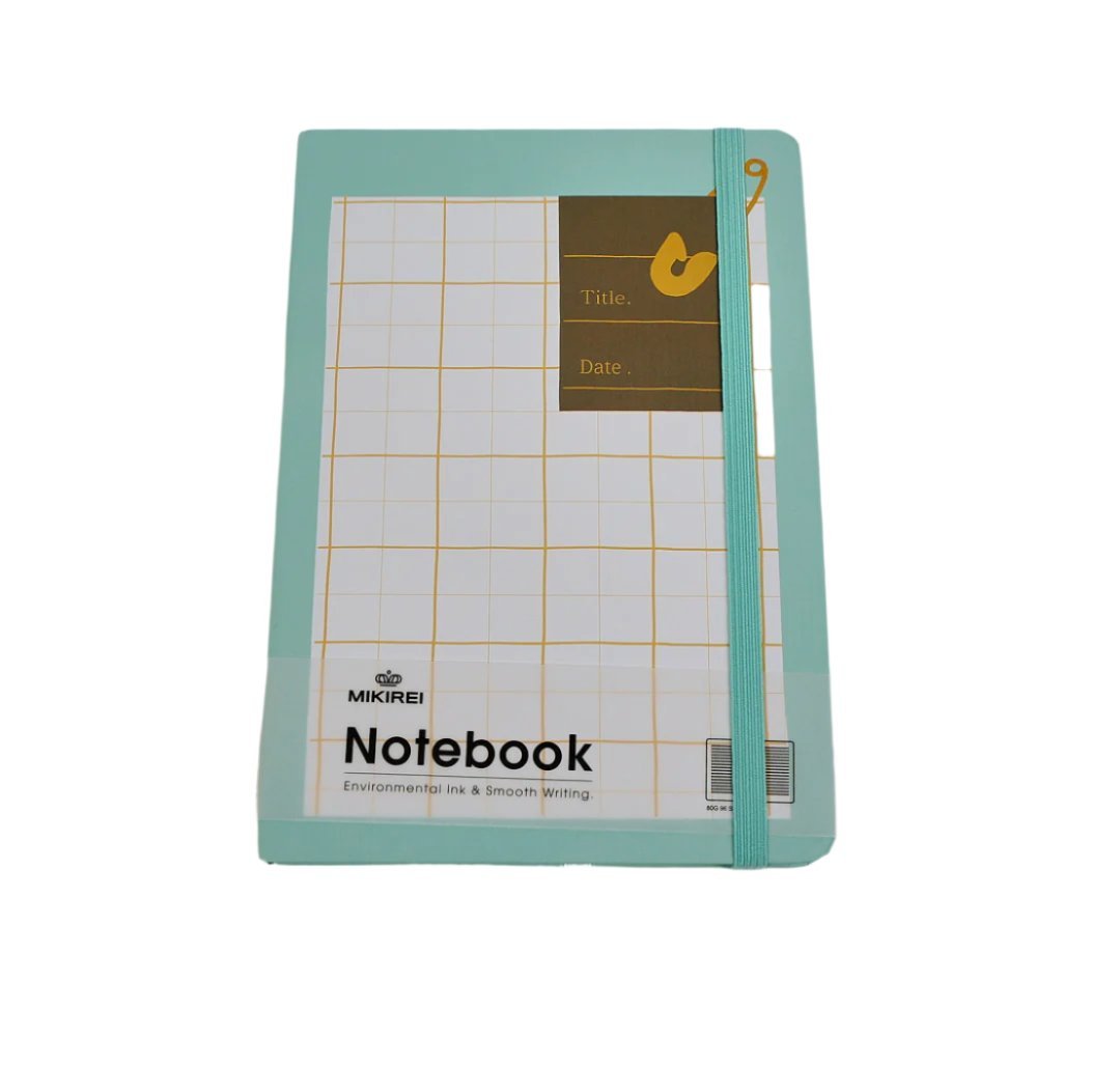Teal A5 soft-cover notebook with grid layout and heart accent, elastic strap.