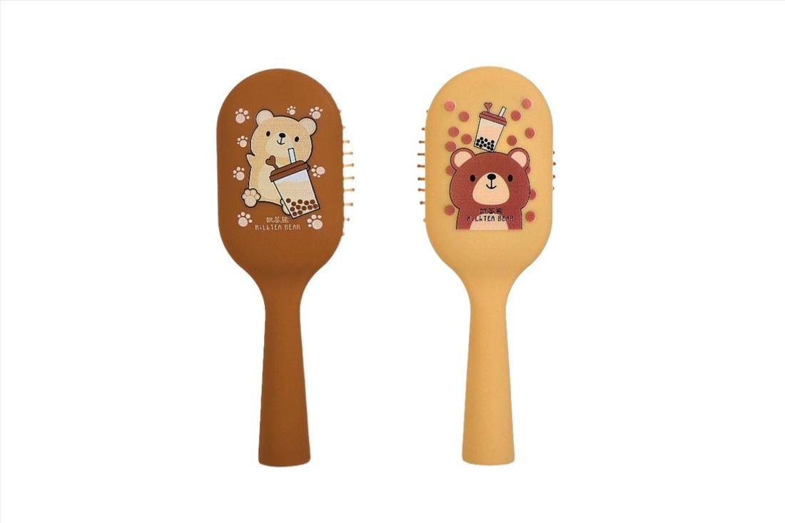 Beige bear-themed vertical massage hairbrush with rounded pin head and handle
