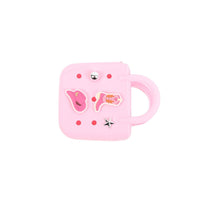 Pink mini silicone handbag with side handle opening, charm patches and silver studs