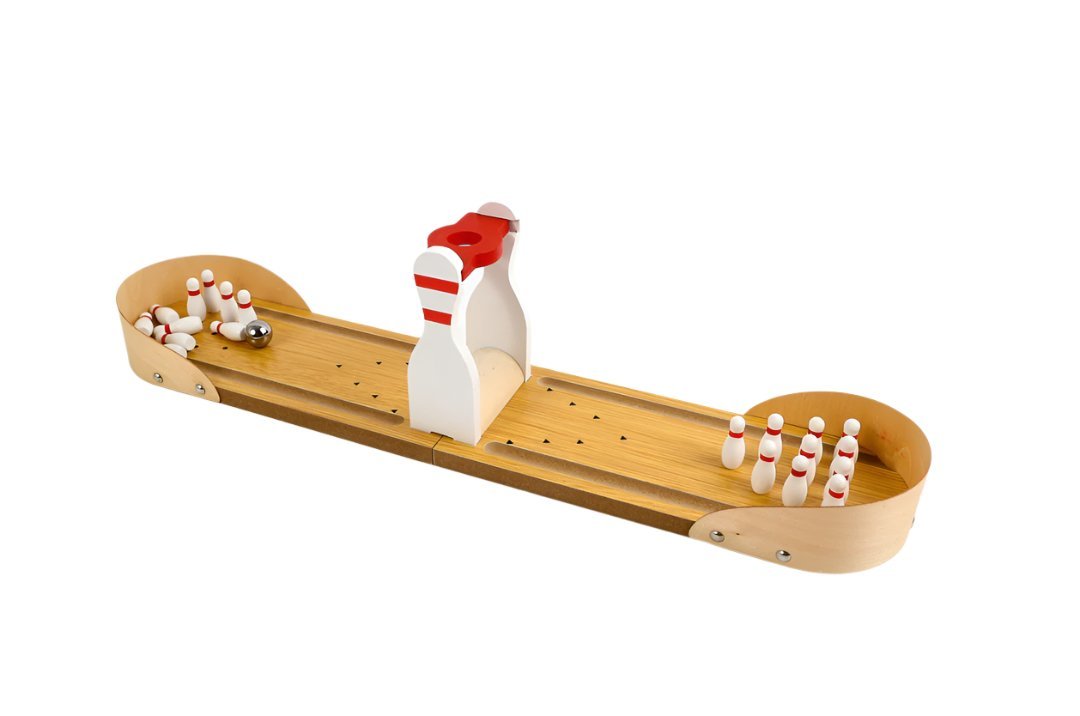 Mini wooden bowling game set with curved lane, pins, and standing pin