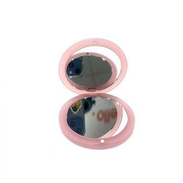 Pink double oval compact mirror with two reflective panels
