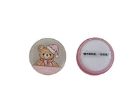 Round makeup loose powder compact showing lid front and smooth underside