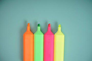 Neon highlighters: orange, green, pink, and yellow, chisel tips.