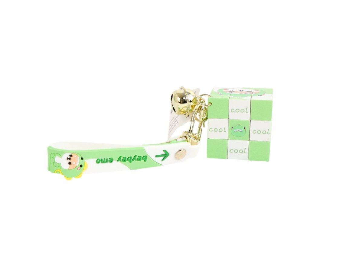 Green ribbon-style keychain with cube charm and bell on a gold keyring