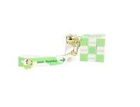 Green ribbon-style keychain with cube charm and bell on a gold keyring