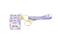 Purple cube keychain with animal card charm and gold keyring