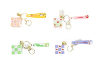 Tiger cube keychain set with four cube designs and colorful ribbon straps, gold keyrings