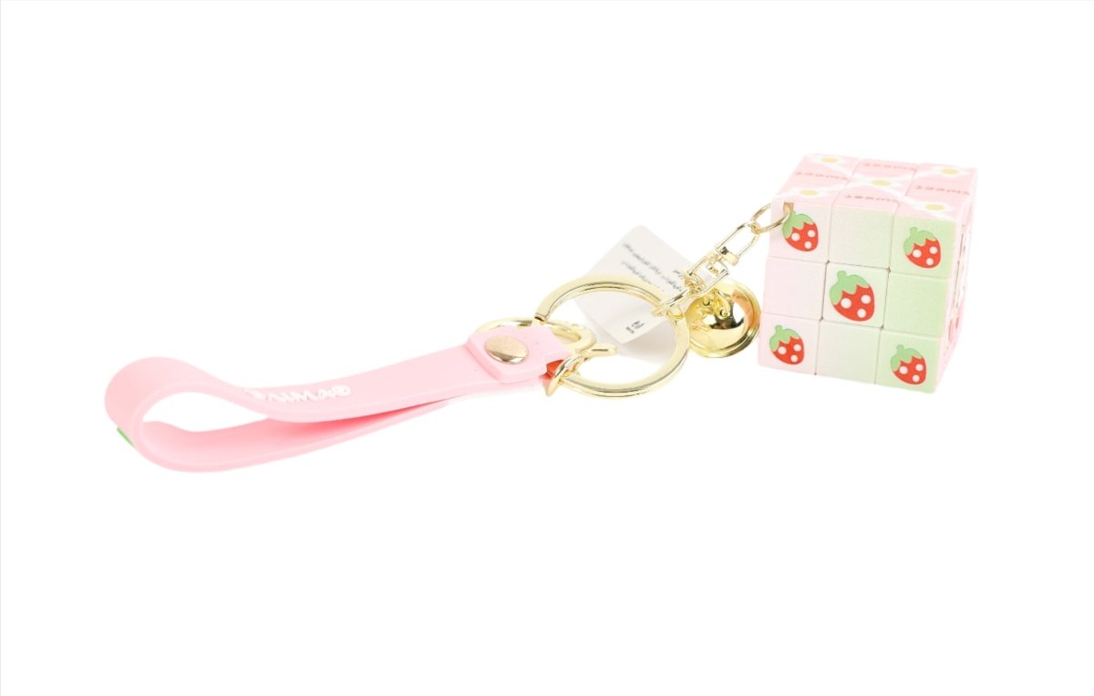 Tiger cube keychain with pale green and pink cube and pink strap with cute icons