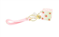 Tiger cube keychain with pale green and pink cube and pink strap with cute icons