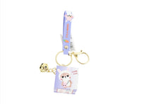 Purple ribbon keychain with rabbit tag card, gold keyring, and bell