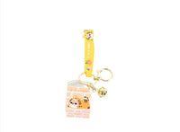 Yellow tiger cube keychain with attached keyring and bell charm