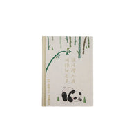 Hardback notebook with white cover, bamboo graphic and panda face illustration