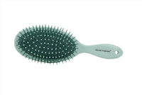 Hair brush for scalp massage with green bristles and mint green handle