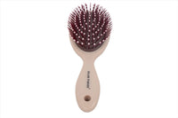 Hair brush for scalp massage with dark maroon bristles and beige handle