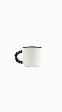 Ceramic panda mug side view with black beaded handle and dark rim on white cup