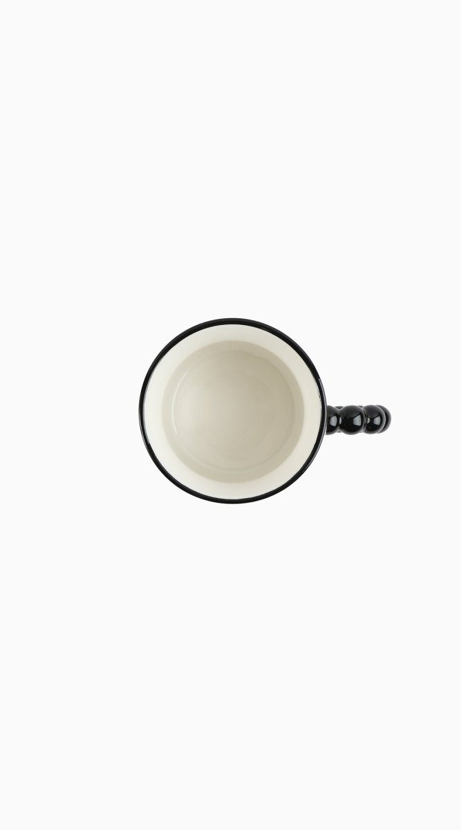 Ceramic panda mug interior view with white bowl, dark rim and black beaded handle