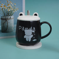 Black ceramic panda cup with lid and spoon, 'Panda' graphic on front