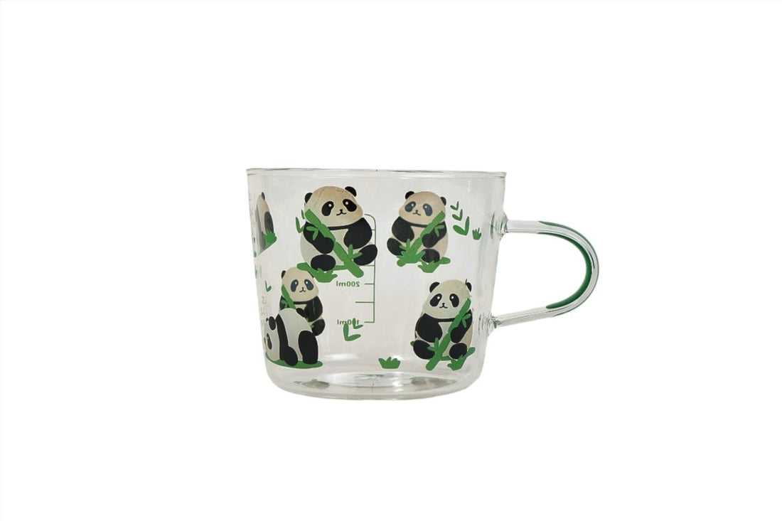 Clear glass mug with scattered panda-and-bamboo print and loop handle