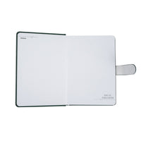Open pastel notebook with white pages and gray magnetic strap, dark green cover edges