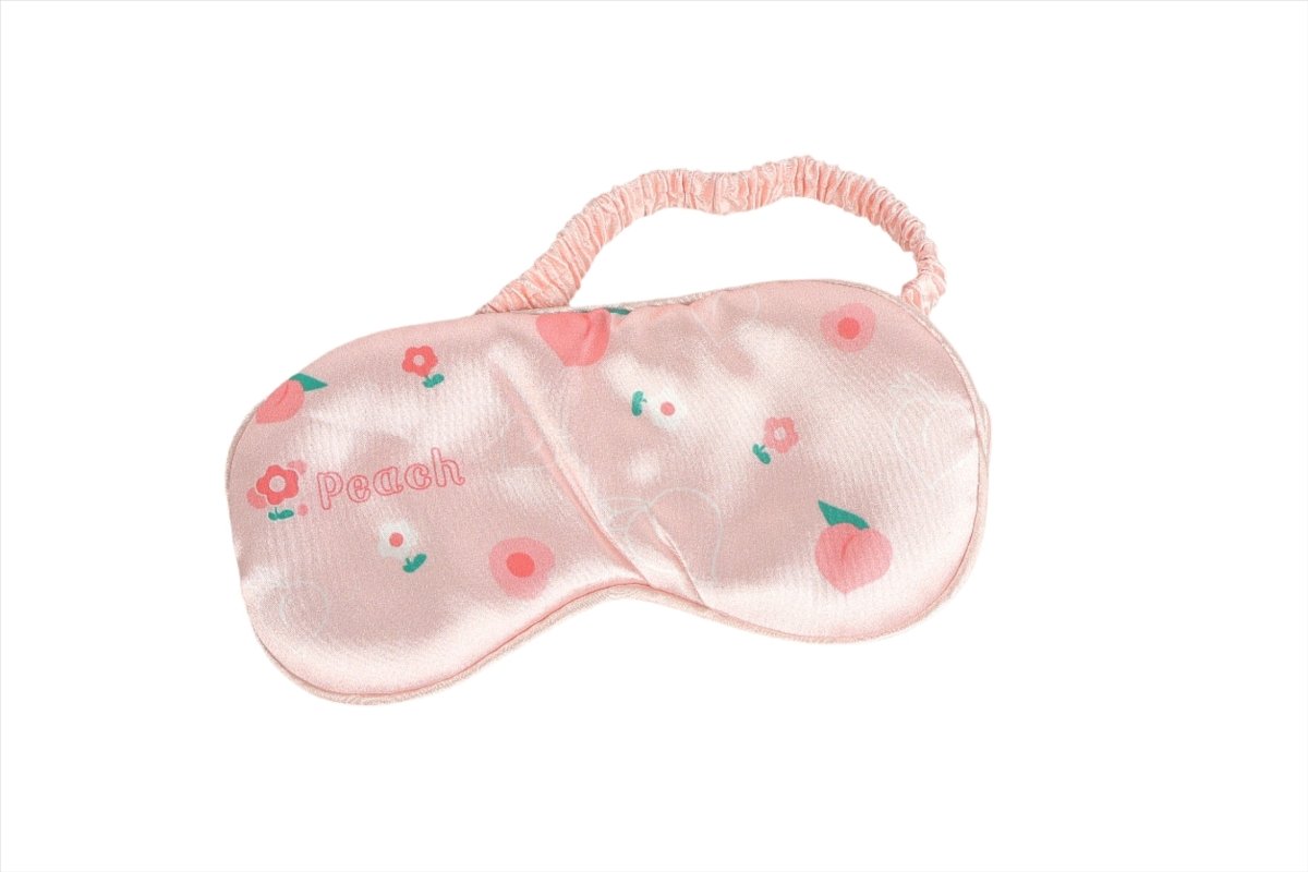 Peach pink silk sleep mask with fruit and flower print, soft elastic strap