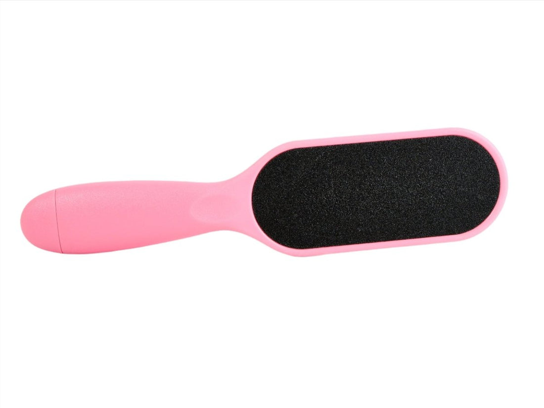 Pink foot file angled view with black abrasive surface