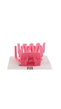 Pink plastic hair clip detail, spring clamp with vertical teeth
