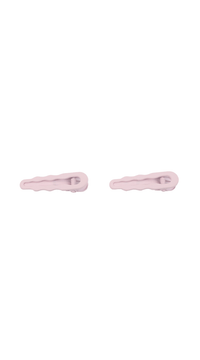 Light pink curved hair clips, two clips with metal springs visible