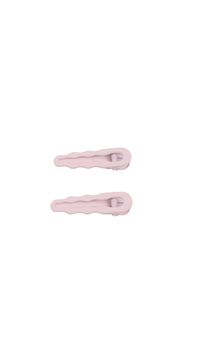 Light pink curved hair clips, two clips shown side-by-side