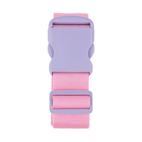 Pink luggage strap with gray latch and pink webbing, close-up on attachment.