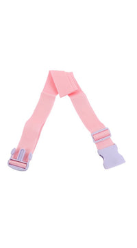 Pink luggage strap with metal clasp and adjustable webbing, laid flat.