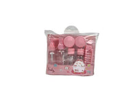 Pink travel toiletry set in clear pouch with bottles, jars, and comb