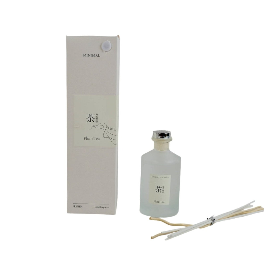 Reed diffuser bottle with plum tea scent, clear glass and metal cap