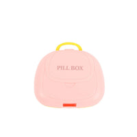 Portable 7-compartment pill box, pink closed with carry handle