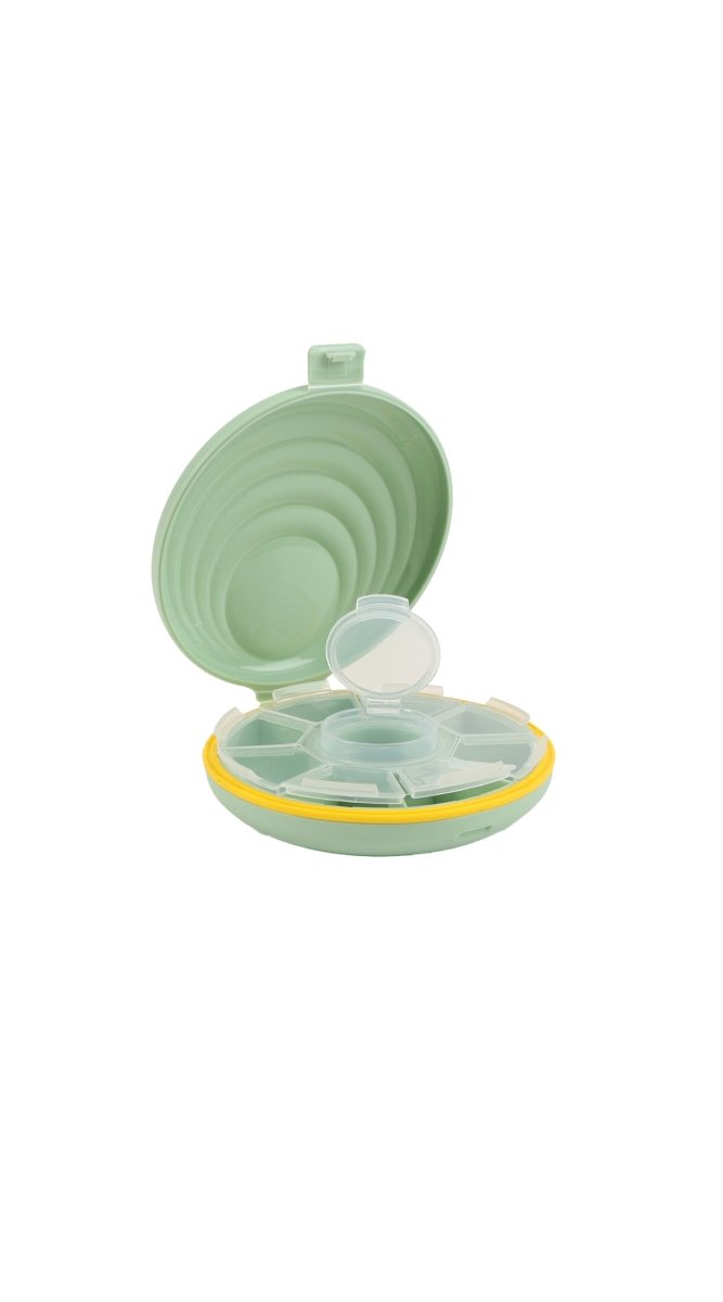 Green portable pill box organizer with round stacked compartments